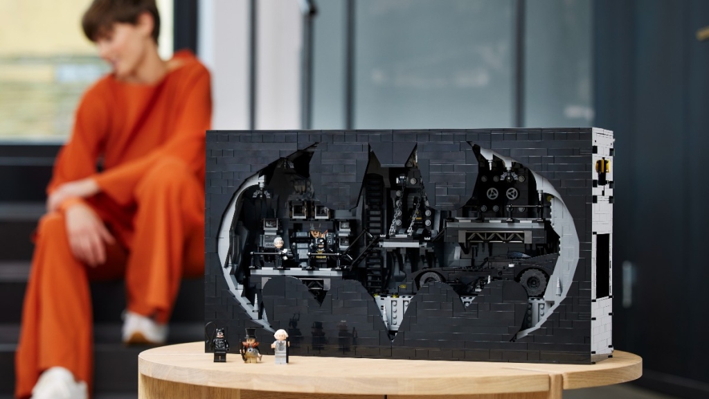 lego batman 76252 batcave shadow box lifestyle background person featured 1024x576
